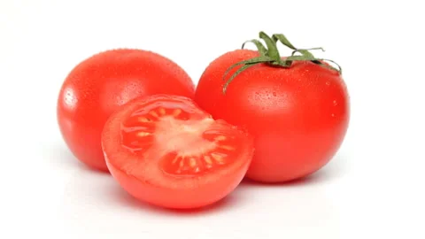 Rotating tomatoes in dew on the white background Video stock 112754217