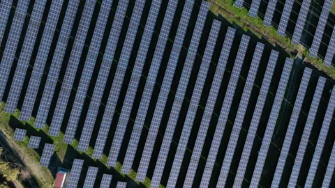 Rotating Top-Down Aerial View of Solar Array Stock Footage 302882992