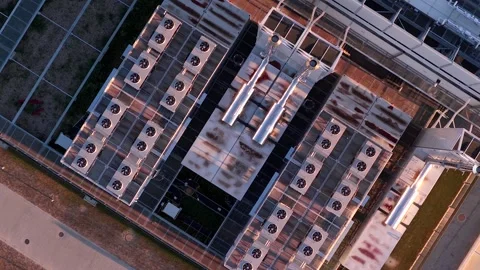 Rotating Top Down Drone View of Data Center Rooftop Cooling Fans in Warsaw Video stock 317087432