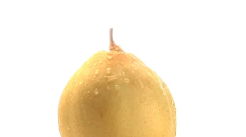 Rotating top portion of yellow pear with water drops Stock Footage 46585586