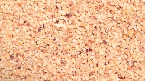 Rotating top view of chopped hazelnuts Stock Footage 141287516