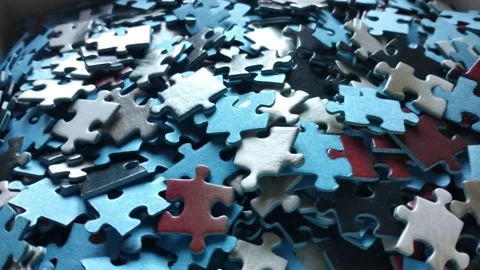 Rotating toy puzzle pieces background. 3d puzzle pieces connection Stock Footage 193997357
