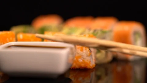 Rotating tray of assorted fresh sushi rolls Stock Footage 96453192