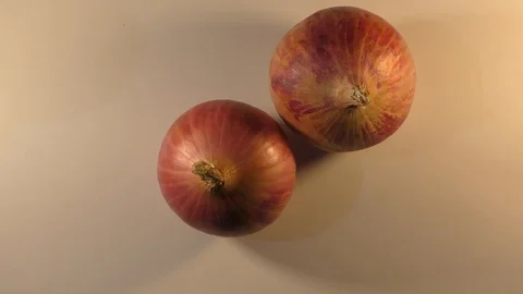 Rotating two onions with full one circle Stock Footage 110859008