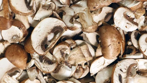 Rotating Of Uncooked Fresh Raw Sliced Royal Champignons Mushrooms. 스톡 동영상 128627038