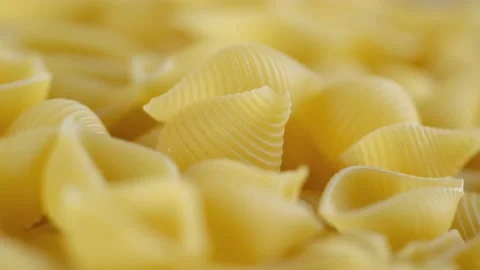 Rotating uncooked pasta . Stack of traditional dry raw macaroni. Nobody Stock Footage 171411979