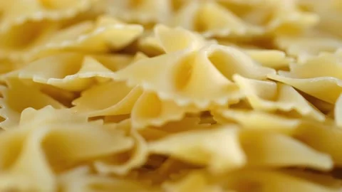 Rotating uncooked pasta . Stack of traditional dry raw macaroni. Nobody 스톡 동영상 171949194