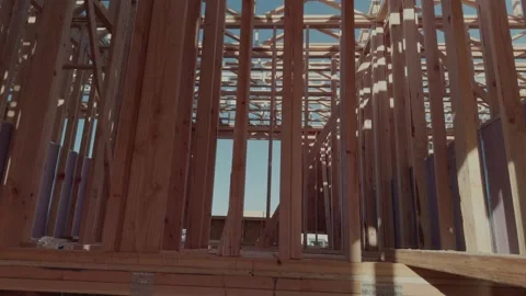 Rotating Upward Pan Inside Wooden House Framing Under Construction Stock Footage 334577875