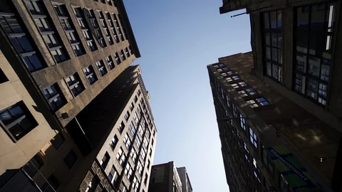 Rotating upward shot showcasing the height of the typical Manhattan Video stock 120230774