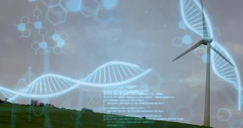 Rotating utility scale wind turbine on right green hill, showing DNA helix, h Stock Photos