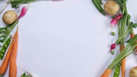Rotating vegetable wreath or frame,circular composition of carrots,radishes Stock Footage 197526437
