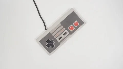 Rotating video game retro handheld controller picked up- Stock Footage 88332318