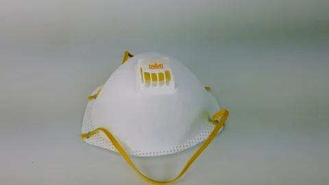 Rotating video shot of the single N95 respirator mask. Stock Footage 127943561