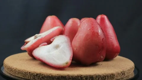 Rotating view of fresh water guava on black background Stock Footage 288991653