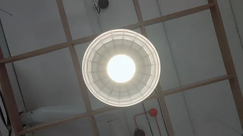 Rotating View of Industrial Ceiling Light Fixture in Modern Interior Stock Footage 337795865