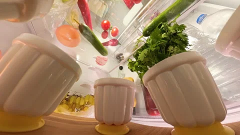 Rotating view from inside a refrigerator, shifting perspective from top to Stock Footage 292773066