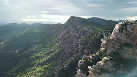 Rotating view of mountains with lots of vegetation on a beautiful sunny day Stock Footage 221699240