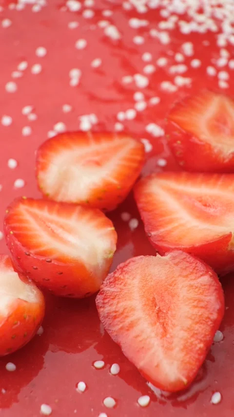 Rotating view of strawberry jelly cake decorated with fresh sliced berries and w Stock Footage 342028426