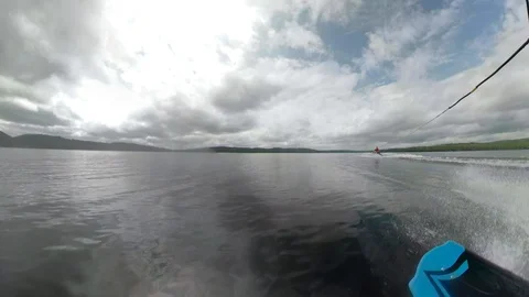 Rotating view of wakeboarder on water Stock Footage 93525599