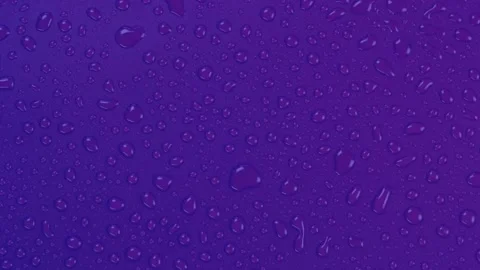 Rotating violet background with water drops top view Stock Footage 198025723