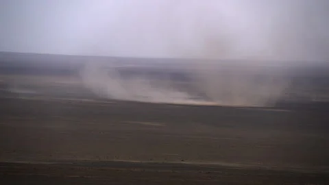 Rotating vortex of dust storm in the vast expanses in Mongolian Gobi Desert Stock Footage 308767167
