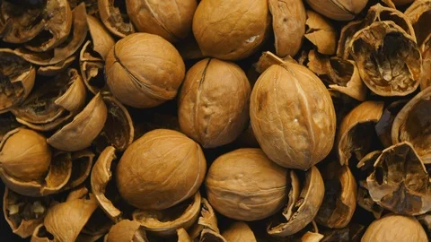Rotating Walnut And Shell On The Black Plate On Turntable Top View. Stock Footage 121124981