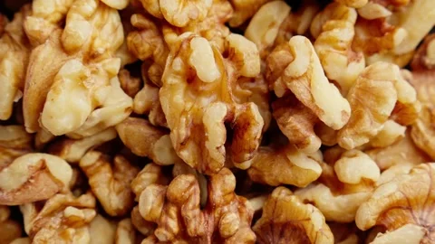 Rotating walnuts. Group of peeled walnuts. View from above. Healthy vegan food 스톡 동영상 290308064