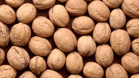 Rotating walnuts shot from above Video stock 119203844