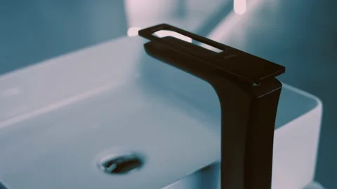 Rotating washbasin. Studio filming. In the background a row of toilets. 4k video Stock Footage 161124994