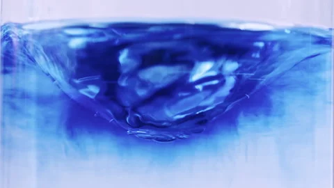 Rotating water funnel with blue paint Stock Footage 263439918