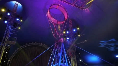 A rotating wheel of death for acrobats to perform under the dome of the circus. Stock Footage 309987103