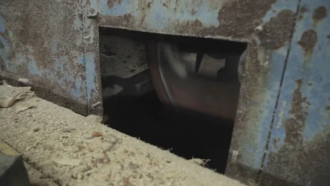 Rotating Wheel Inside Log Sawing Machinery With Multiple Heaps Of Sawdust Stock Footage 164316238