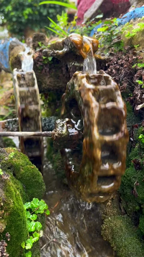 Rotating wheel under the influence of water Stock Footage 303922131