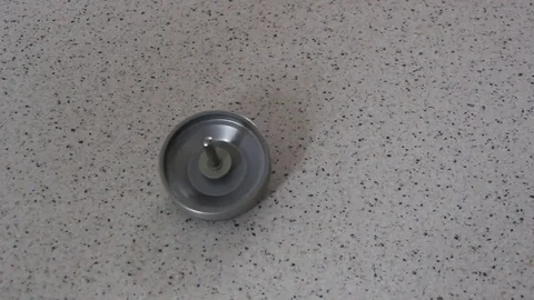 Rotating whirligig spinning on a flat surface Stock Footage 73175574