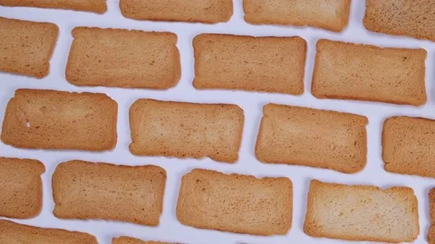 Rotating white background with bread slices or croutons, trendy food background Stock Footage 200002660
