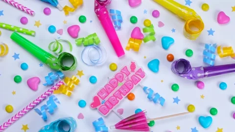 Rotating white background with candies, balloons and tubes for birthday or party Stock Footage 203835405