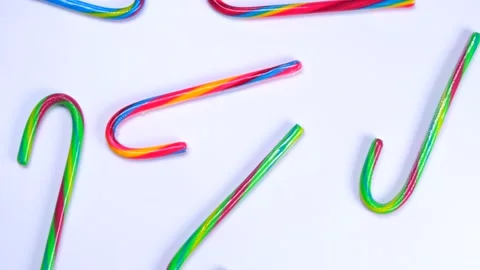 Rotating white background with multi-colored candy canes, New Year holidays and Stock Footage 198553514