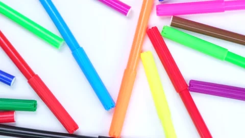 Rotating white background with multi-colored felt-tip pens Stock Footage 212110941