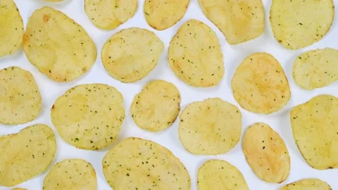 Rotating white background with potato chips close up .fashion,food background Stock Footage 197332919