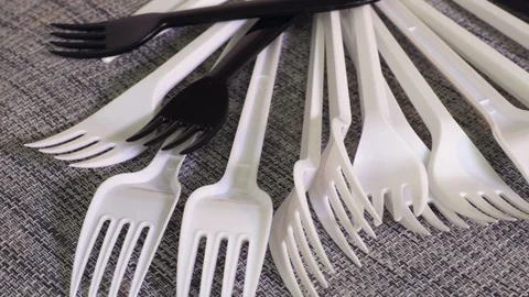 Rotating white plastic forks close up Stock Footage 120846436