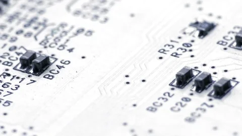 Rotating White Printed Circuit Board, Microprocessors, Capacitors and Audio Stock Footage 77698521