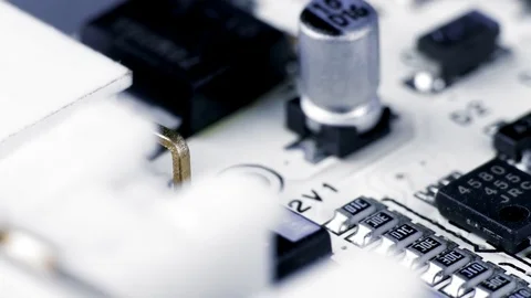 Rotating White Printed Circuit Board, Microprocessors, Capacitors and Audio Stock Footage 78610964