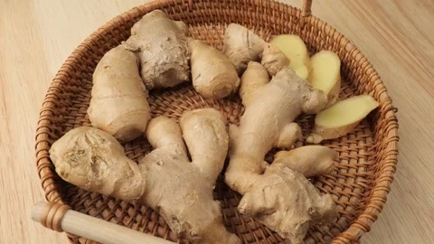 Rotating wicker basket of fresh ginger root Stock Footage 347099635