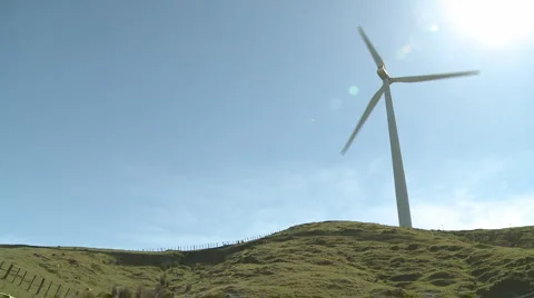Rotating wind turbine and shadow Stock Footage 950178