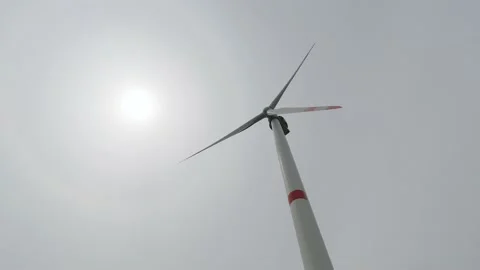 Rotating wind turbine blades from below Stock Footage 236406929