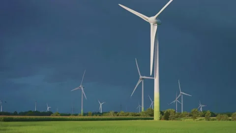 Rotating wind turbines on the background of the dark stormy sky. Parallax Stock Footage 262710969