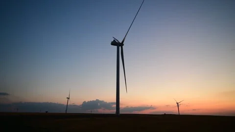 Rotating wind turbines at twilight Stock Footage 274216214