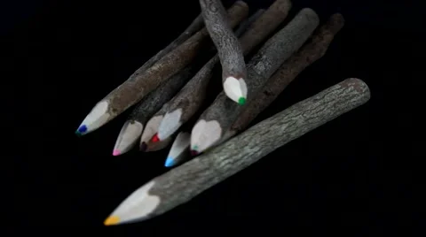 Rotating wood color pencils on black background Stock Footage