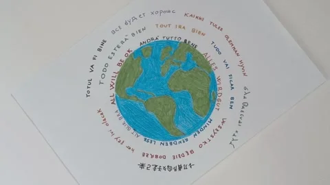 Rotating world drawing with 'all will be ok' for global hope Видео 279846468