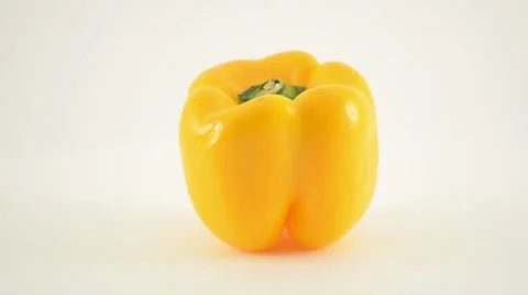 Rotating Yellow Pepper Against White - Dolly Right Stock Footage 22803333